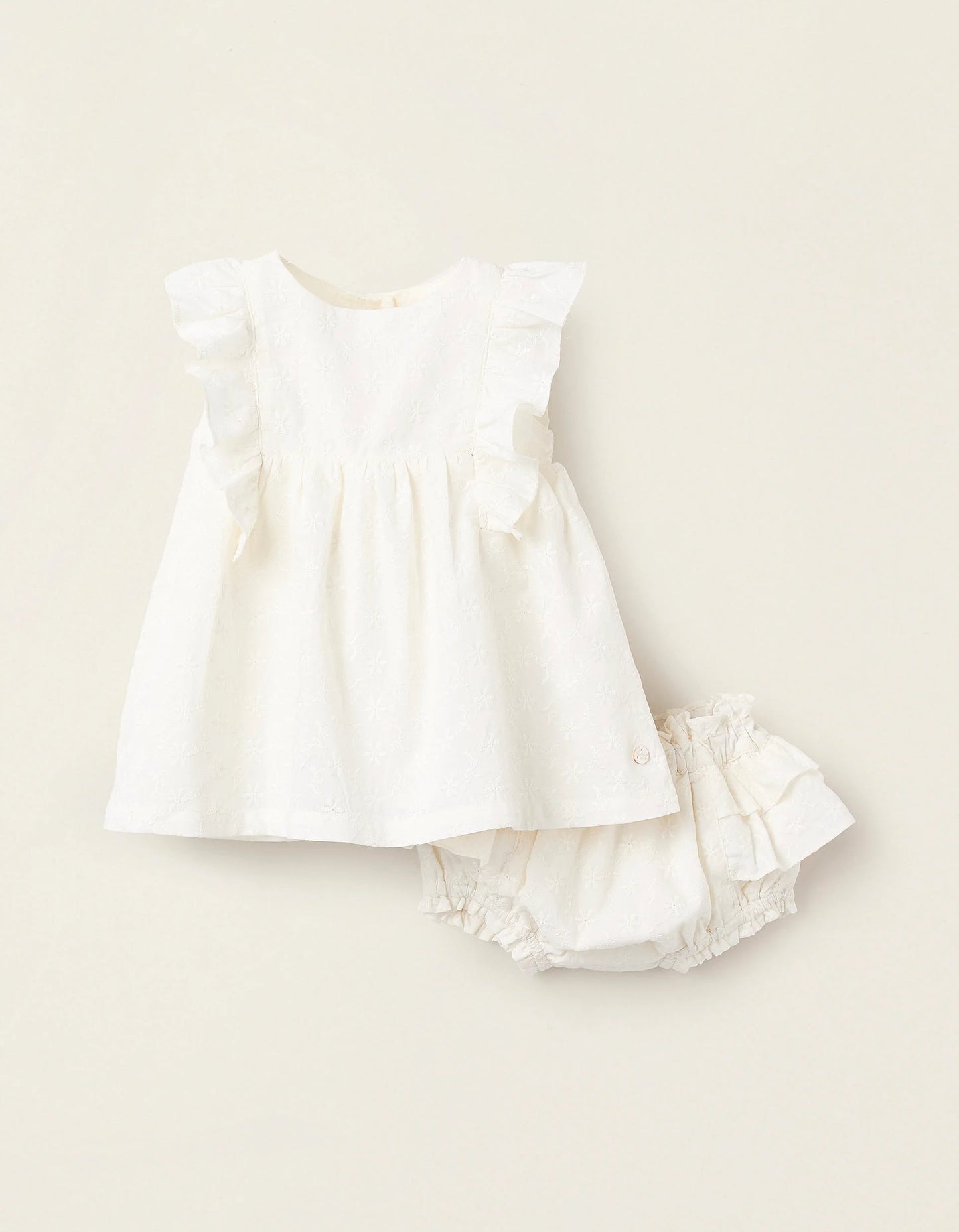 Vestito con volant e ricami neonata