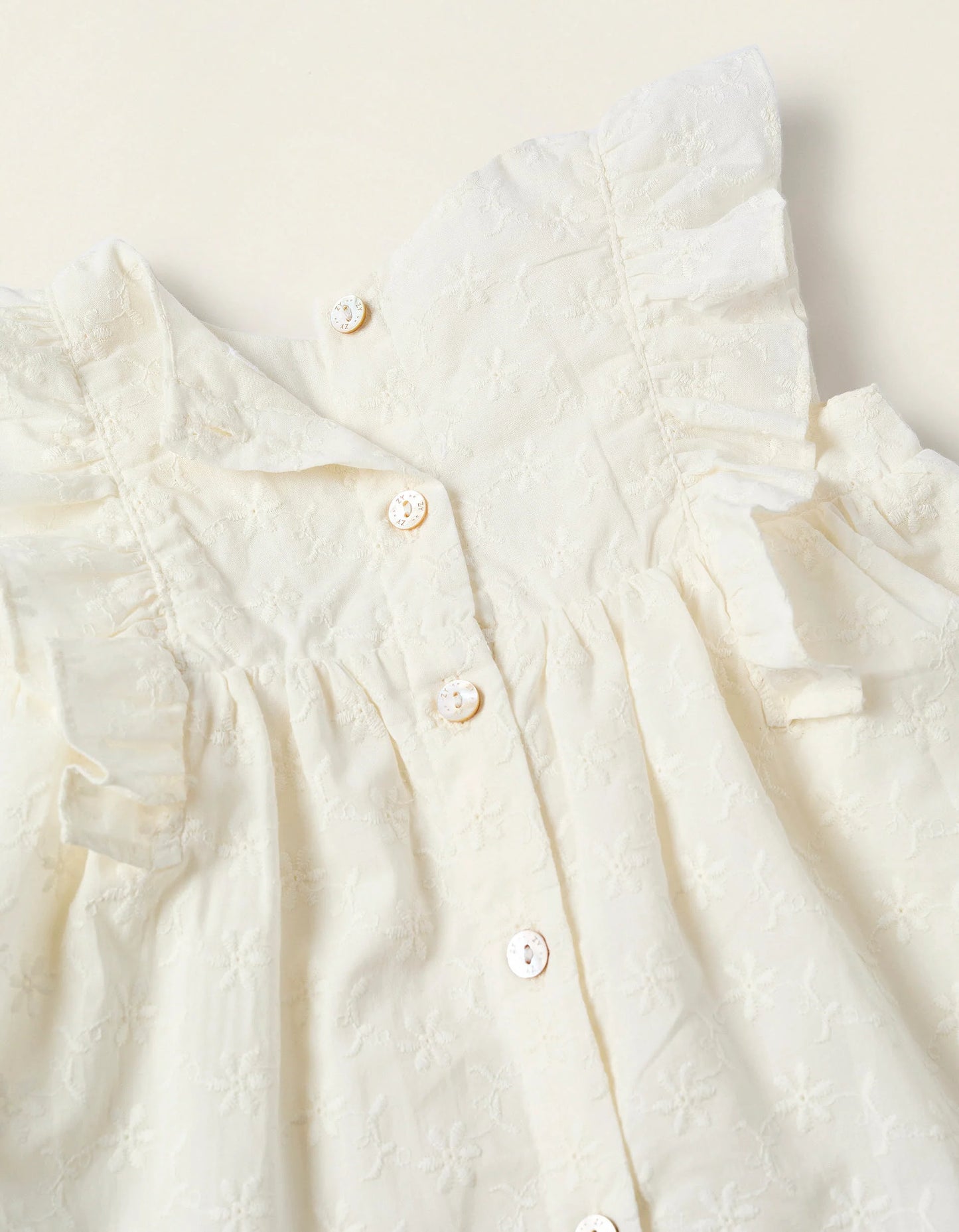 Vestito con volant e ricami neonata